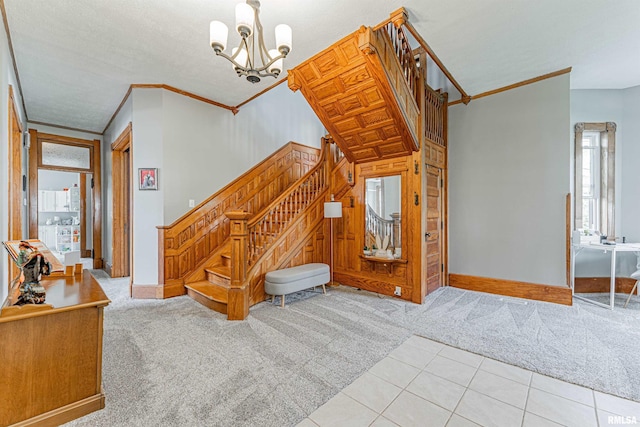 stairs featuring an inviting chandelier, plenty of natural light, and carpet floors