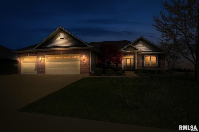 5909 Hedley Rd, Springfield, IL 62711 - view of front facade featuring driveway, brick siding, and a garage
