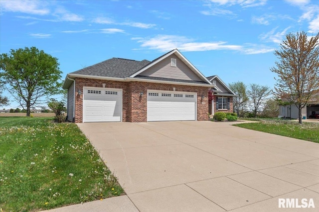view of front of property featuring brick siding, a front yard, driveway, and an attached garage