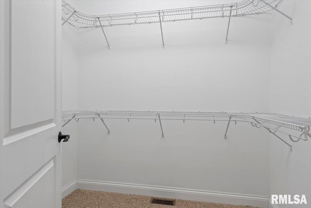 walk in closet with visible vents