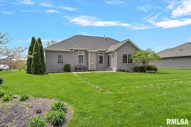 back of property with a patio and a lawn