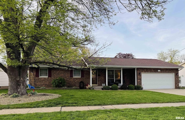 ranch-style home with a porch, an attached garage, brick siding, driveway, and a front yard