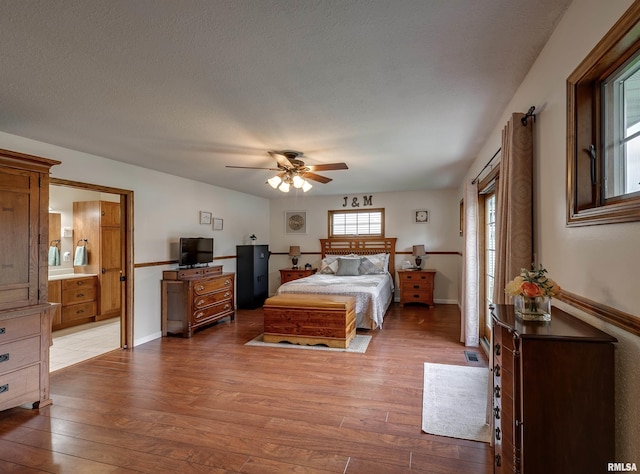 bedroom with ceiling fan and hardwood / wood-style flooring