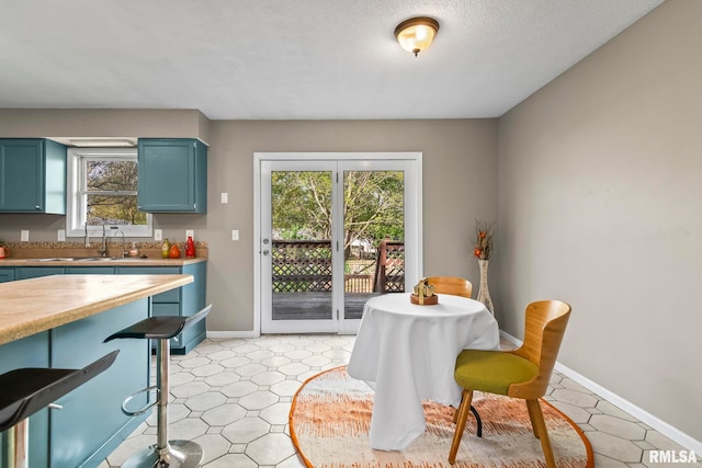 dining space with baseboards