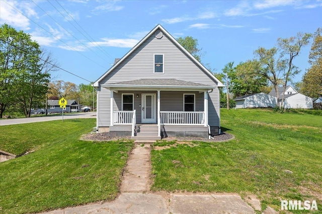 bungalow-style house featuring a front lawn and covered porch