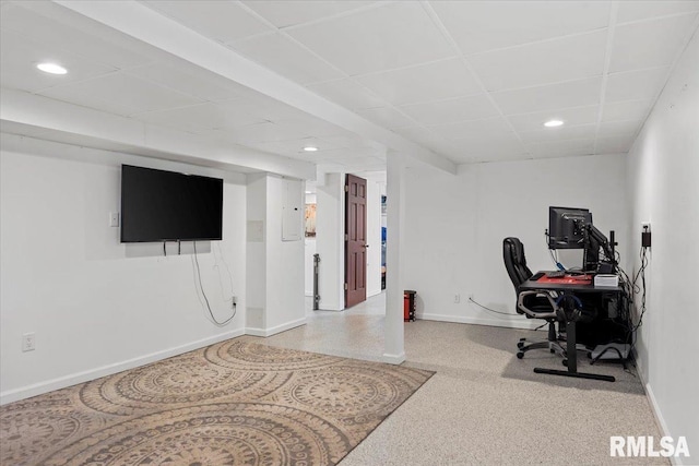 office space featuring recessed lighting, baseboards, and a drop ceiling
