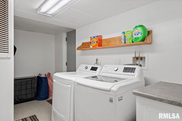 laundry room featuring separate washer and dryer and laundry area