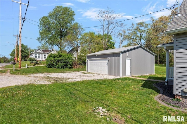 view of yard with an outdoor structure and a garage
