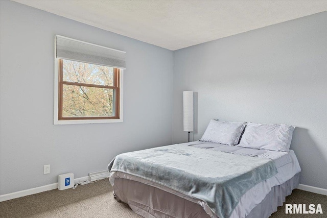 bedroom featuring carpet floors and baseboards