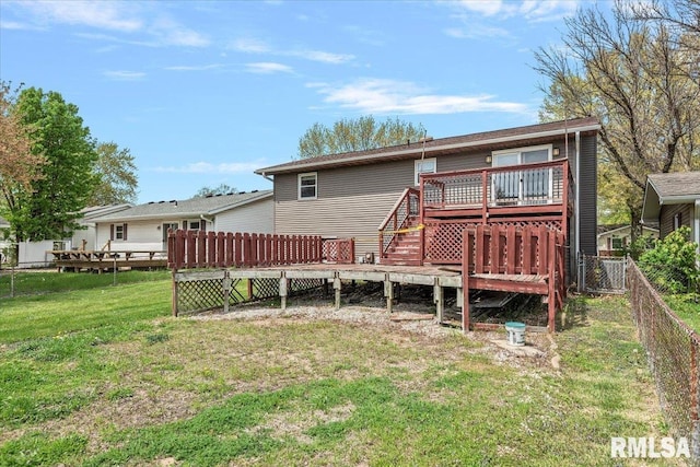 back of property featuring stairway, a wooden deck, a fenced backyard, and a yard