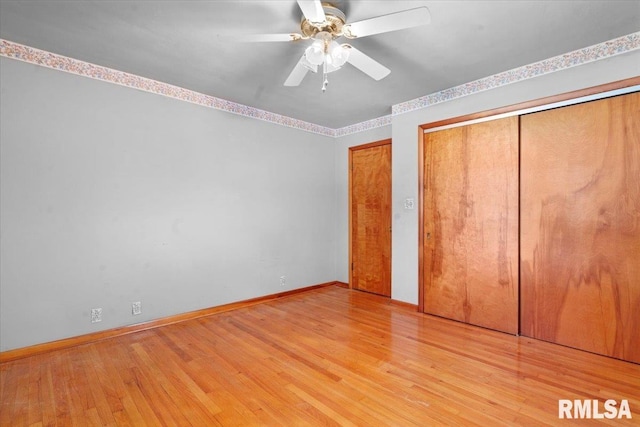 unfurnished bedroom featuring baseboards, ceiling fan, and light wood-style flooring