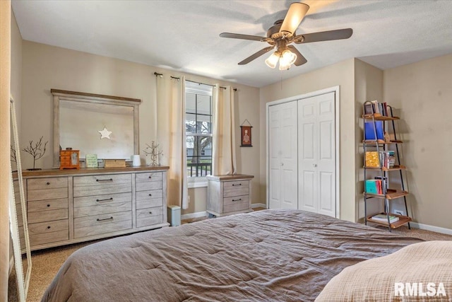 bedroom featuring a closet, ceiling fan, carpet floors, and baseboards