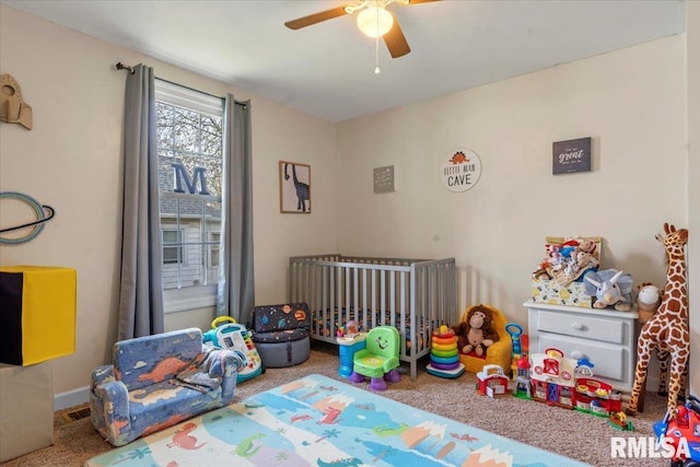 playroom with carpet and ceiling fan
