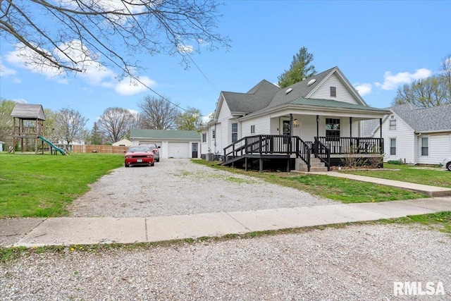 bungalow-style house with a garage, a porch, a front yard, and a playground