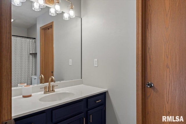 full bath featuring vanity and toilet