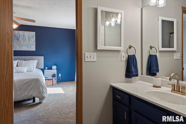 bathroom featuring vanity and a ceiling fan