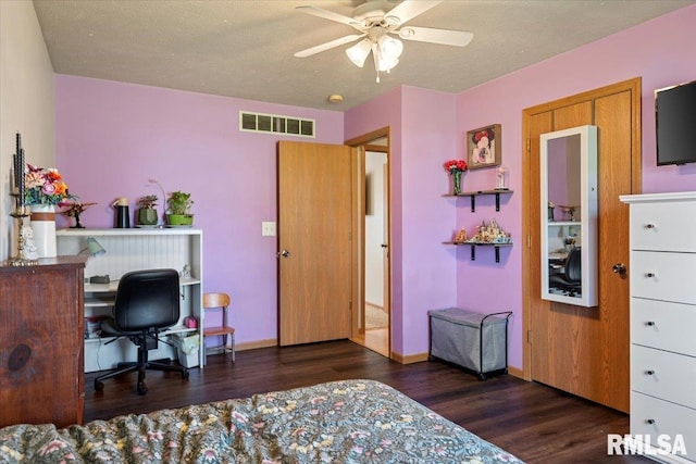 bedroom featuring ceiling fan, baseboards, visible vents, and wood finished floors