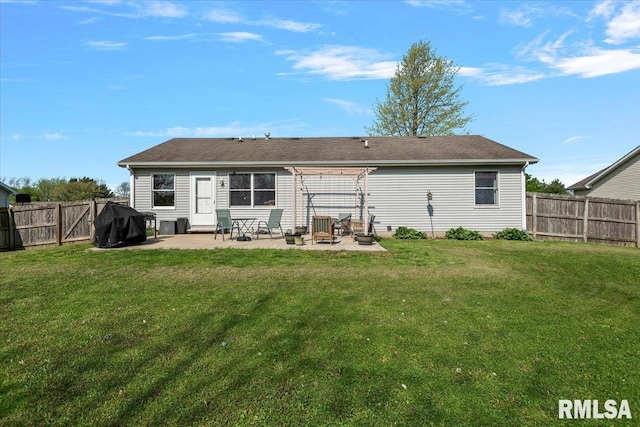back of house featuring a yard, a pergola, a patio, and a fenced backyard