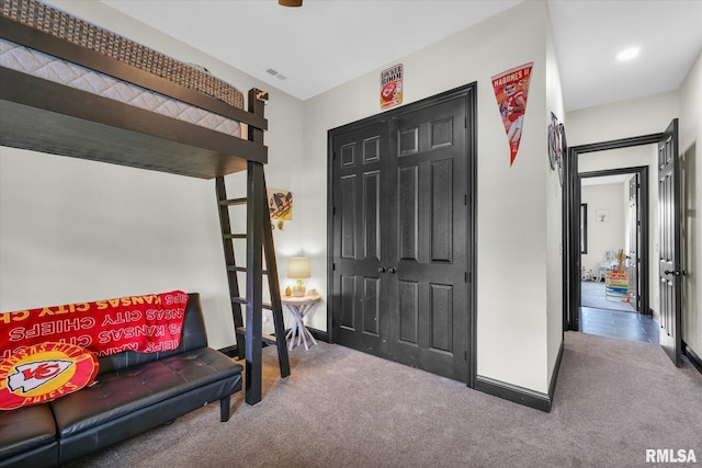 interior space featuring baseboards, recessed lighting, and carpet