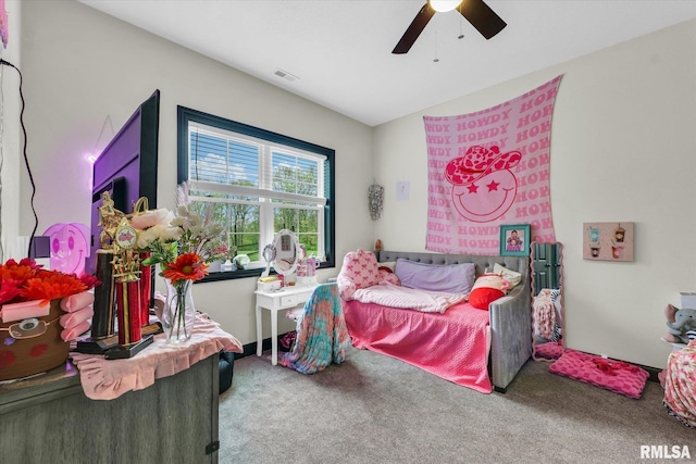 carpeted bedroom with visible vents and ceiling fan