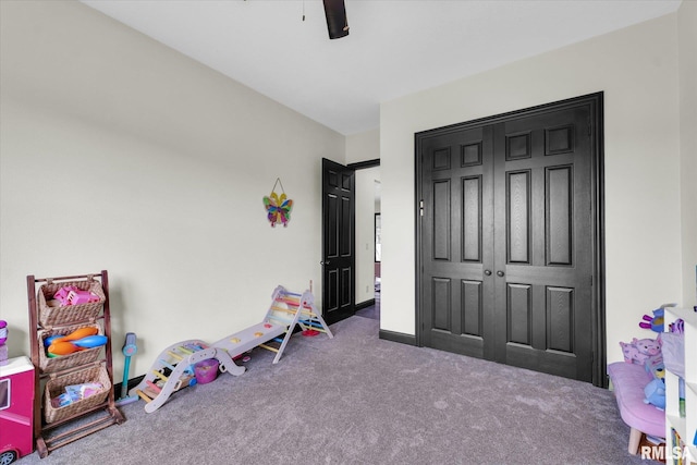 rec room with carpet floors and baseboards