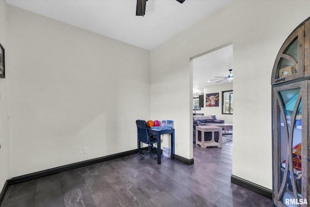recreation room featuring ceiling fan, dark wood finished floors, and baseboards