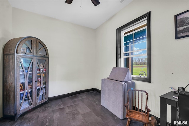 office with ceiling fan and baseboards