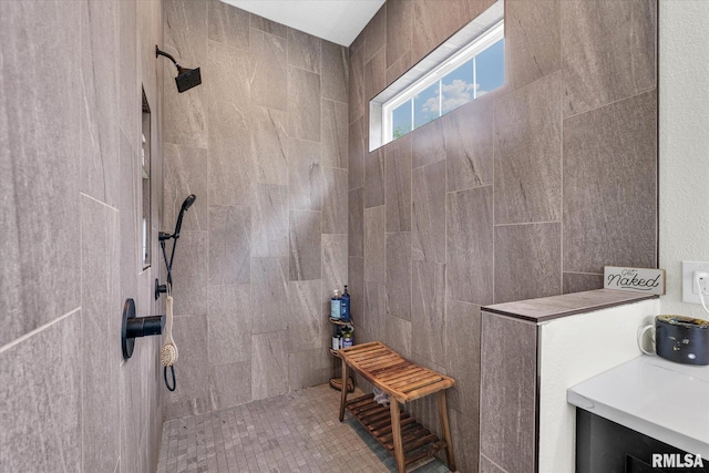 full bath with a tile shower