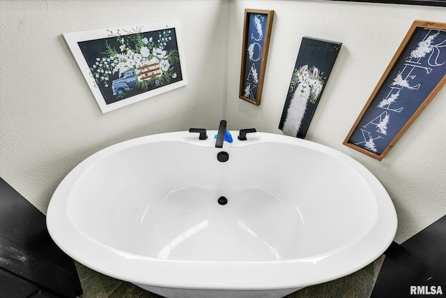 bathroom with a freestanding bath
