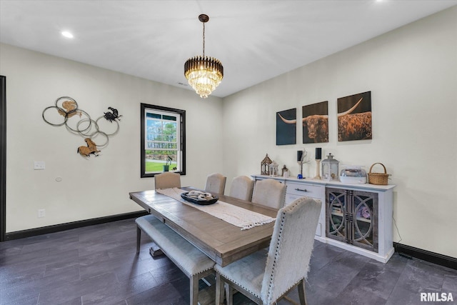 dining area with dark wood-style flooring, recessed lighting, a notable chandelier, and baseboards