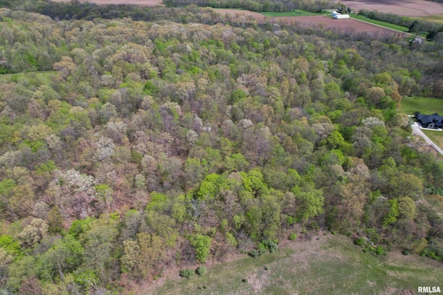 bird's eye view featuring a forest view