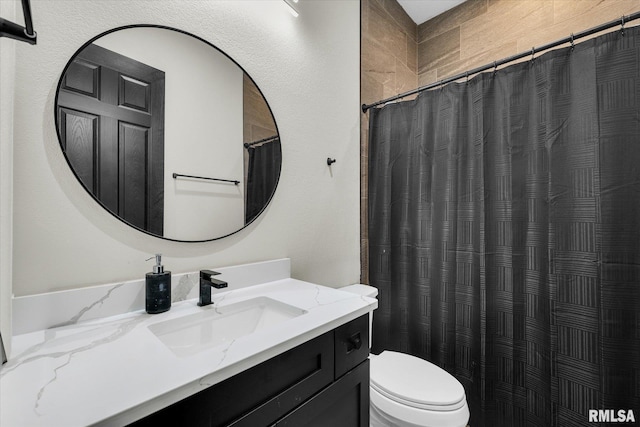 full bathroom with toilet, vanity, and a shower with shower curtain
