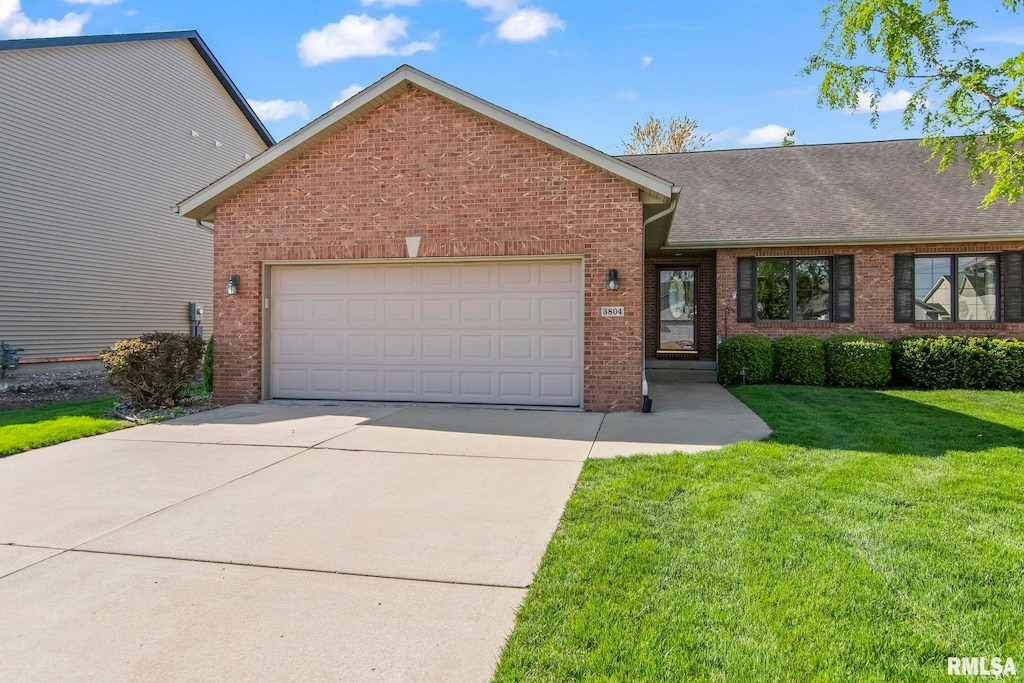 single story home with roof with shingles, a front lawn, brick siding, a garage, and concrete driveway