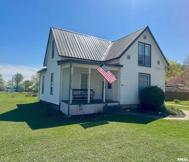 502 E Main St, Plymouth, IL 62367 - view of front of house with covered porch, metal roof, and a front yard