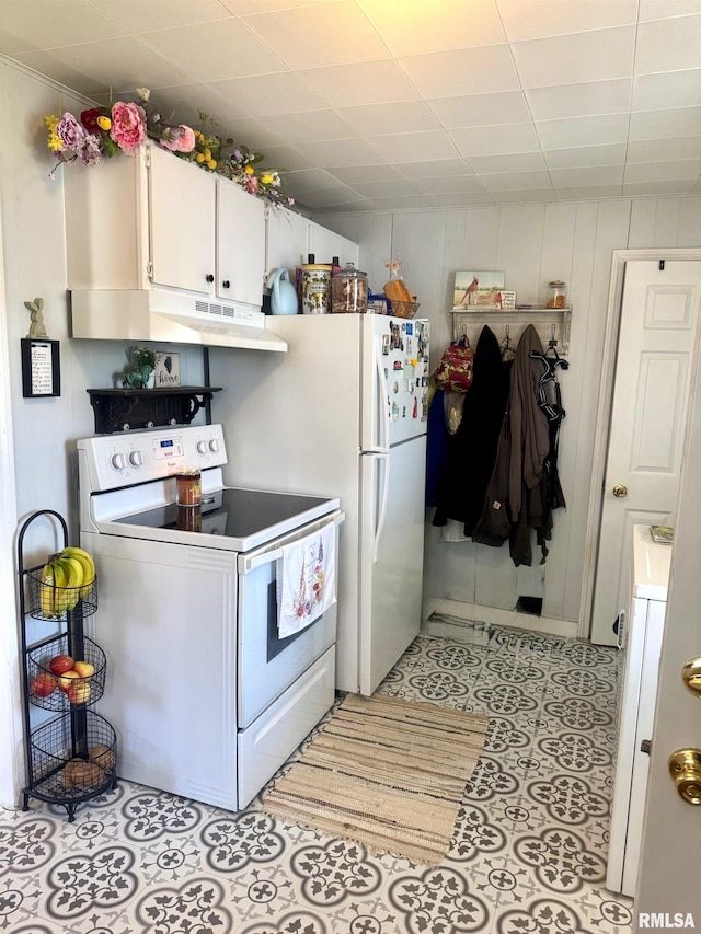 502 E Main St, Plymouth, IL 62367 - kitchen featuring white cabinetry, white appliances, washer / clothes dryer, and under cabinet range hood