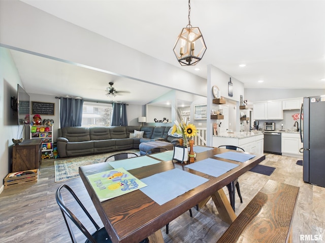 dining room featuring ceiling fan and light wood-style floors
