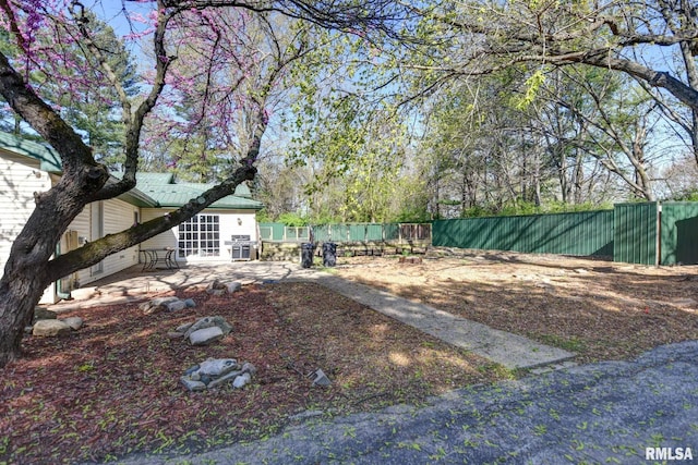 view of yard featuring a patio and fence