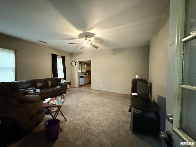 203 N 5th St, Oquawka, IL 61469 - living room with a ceiling fan and carpet flooring