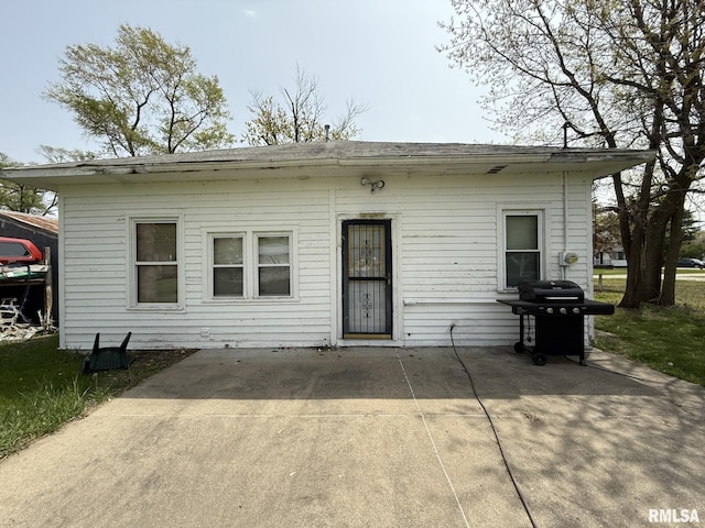 203 N 5th St, Oquawka, IL 61469 - rear view of house featuring a patio