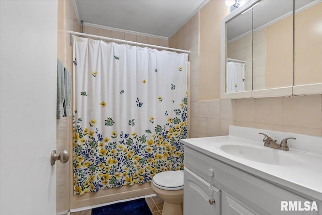 full bathroom with toilet, tile walls, ornamental molding, and vanity