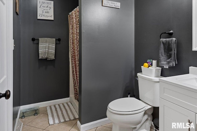 bathroom with vanity, curtained shower, tile patterned floors, toilet, and baseboards