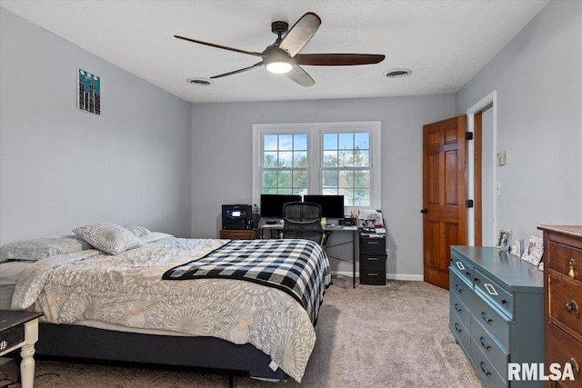 bedroom with a ceiling fan, visible vents, light carpet, and baseboards