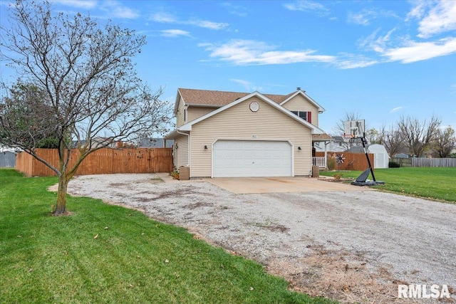 view of side of property featuring a garage, fence, dirt driveway, and a yard