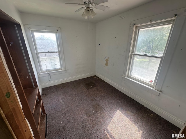 705 Olive St, Galesburg, IL 61401 - unfurnished room featuring ceiling fan and baseboards