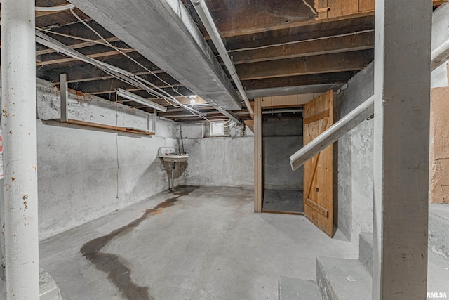 unfinished basement with a sink