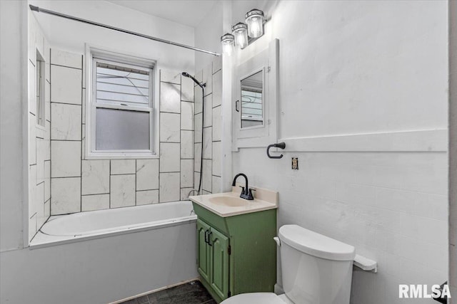 full bath featuring vanity, toilet, and shower / tub combination