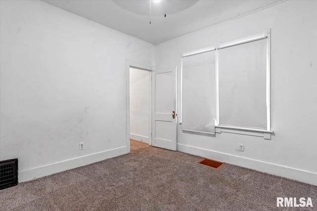 interior space with baseboards and carpet flooring
