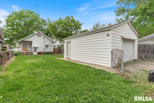 detached garage featuring fence