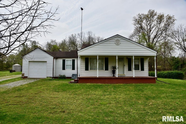 22 Roundhouse Rd, Herod, IL 62947 - view of front of property featuring a shingled roof, a garage, a porch, a front yard, and gravel driveway