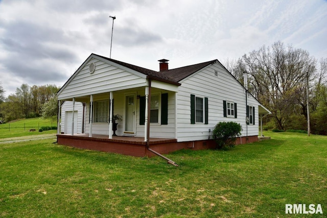 22 Roundhouse Rd, Herod, IL 62947 - view of front of house with covered porch, a chimney, and a front lawn